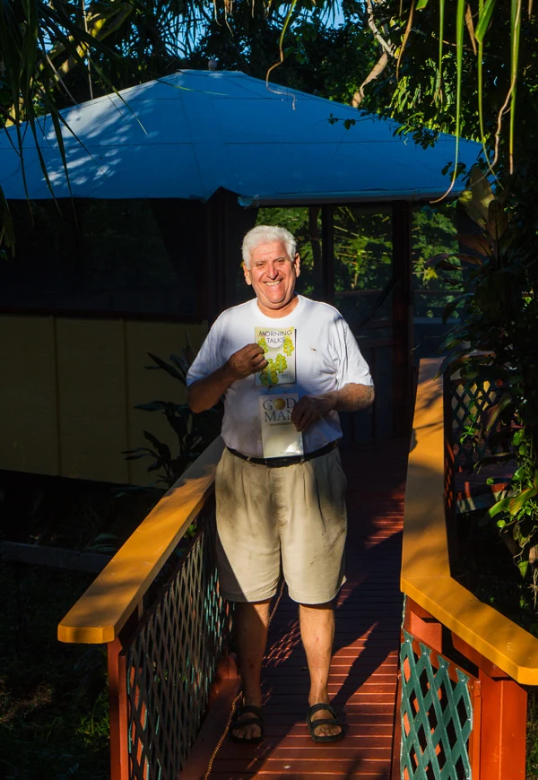 KMEC founder Leonard Sussman on a tropical walkway